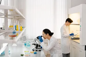 Two scientists working in a well-equipped laboratory with microscopes and test tubes. jigsaw puzzle