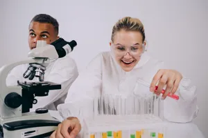 Two scientists working in a lab with test tubes and a microscope, engaging in research. jigsaw puzzle