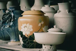 A collection of elegant handcrafted ceramic vases featuring detailed floral designs. jigsaw puzzle