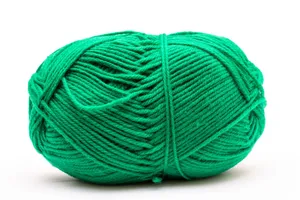 Bright green yarn ball perfect for knitting and crafts, isolated on a white backdrop. jigsaw puzzle