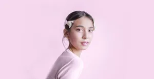 Beautiful portrait of a young woman with subtle pink hues, exuding elegance and simplicity. jigsaw puzzle