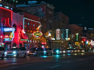 a city street filled with lots of traffic at night jigsaw puzzle
