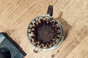 an overhead view of a coffee maker on a wooden table jigsaw puzzle