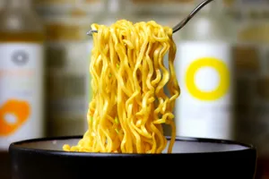 a close up of a bowl of noodles with a fork in it jigsaw puzzle