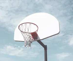 low-angle photography of basketball ring under cloudy sky jigsaw puzzle