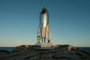 A statue of a rocket sitting on top of a rock jigsaw puzzle