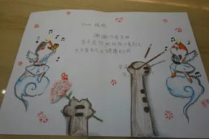 Children's drawing of cats singing and a flower jigsaw puzzle