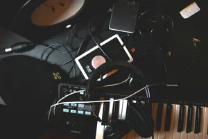 flat-lay photo of headphones, MIDI keyboard, and speaker on black surface jigsaw puzzle