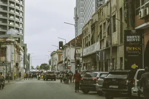 Bustling street scene in downtown Luanda, Angola with historic and modern buildings. jigsaw puzzle