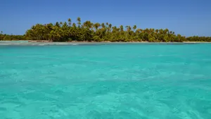 Discover a serene tropical island surrounded by clear turquoise waters, ideal for a summer getaway. jigsaw puzzle