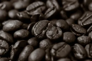 Detailed close-up of roasted coffee beans, highlighting texture and rich brown color. jigsaw puzzle