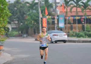 A male athlete running in a marathon on a city street, showing determination and stamina. jigsaw puzzle
