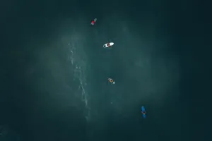Drone shot of surfers paddling in the ocean off Terengganu, Malaysia. jigsaw puzzle