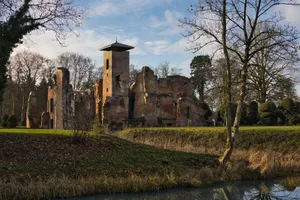 Explore the enduring beauty of a historic castle ruin surrounded by nature at sunset. jigsaw puzzle