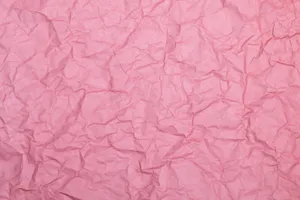 High-resolution close-up of a wrinkled pink paper texture, ideal for design use. jigsaw puzzle