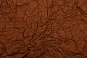 A rich brown textured paper with a crumpled surface, ideal for backgrounds. jigsaw puzzle