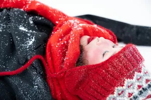 Woman dressed warmly in winter attire, covered in snow. Perfect for seasonal themes. jigsaw puzzle