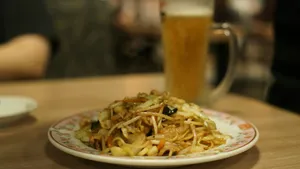 a plate of food and a glass of beer on a table jigsaw puzzle