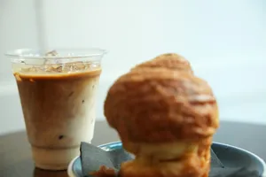 Iced coffee and a pastry on a table jigsaw puzzle