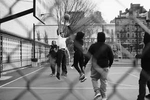 grayscale photo of group of men playing street basketball jigsaw puzzle