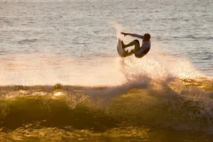 photo of man surfing during daytime jigsaw puzzle
