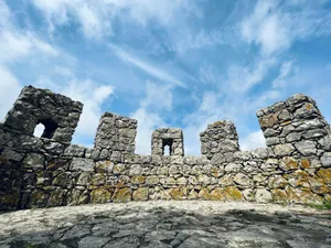 a stone wall with a sky background jigsaw puzzle