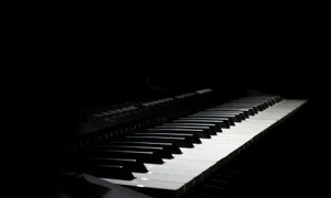 a piano keyboard with a black background jigsaw puzzle