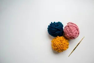 blue and red yarn on white surface jigsaw puzzle